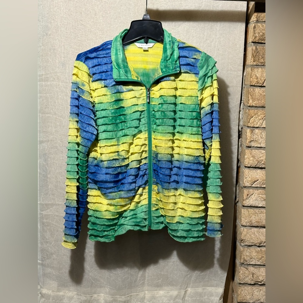 Erin London, citrus colored,ruffled jacket.